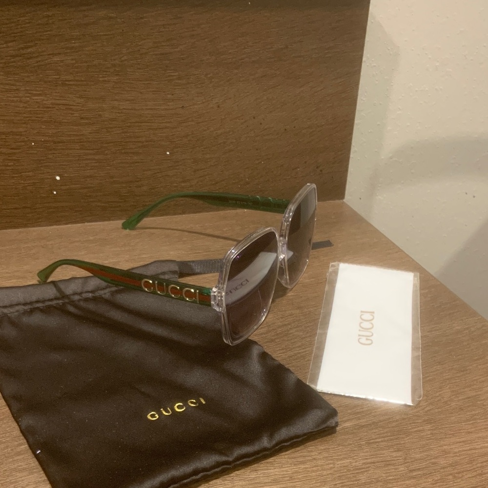 Gucci Clear Frame Sunglasses with Green Temples